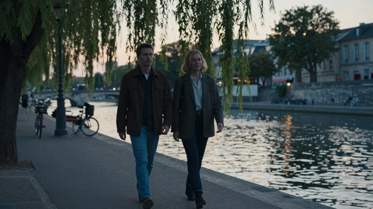 A couple walking peacefully along Canal Saint-Martin at sunset, reflections on water, serene and present.