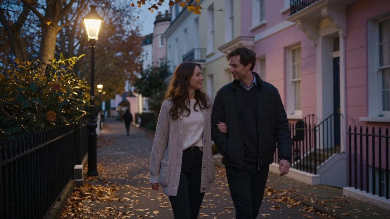 A man and woman walking arm-in-arm through a leafy London neighborhood at dusk, enjoying a peaceful, unscripted moment.