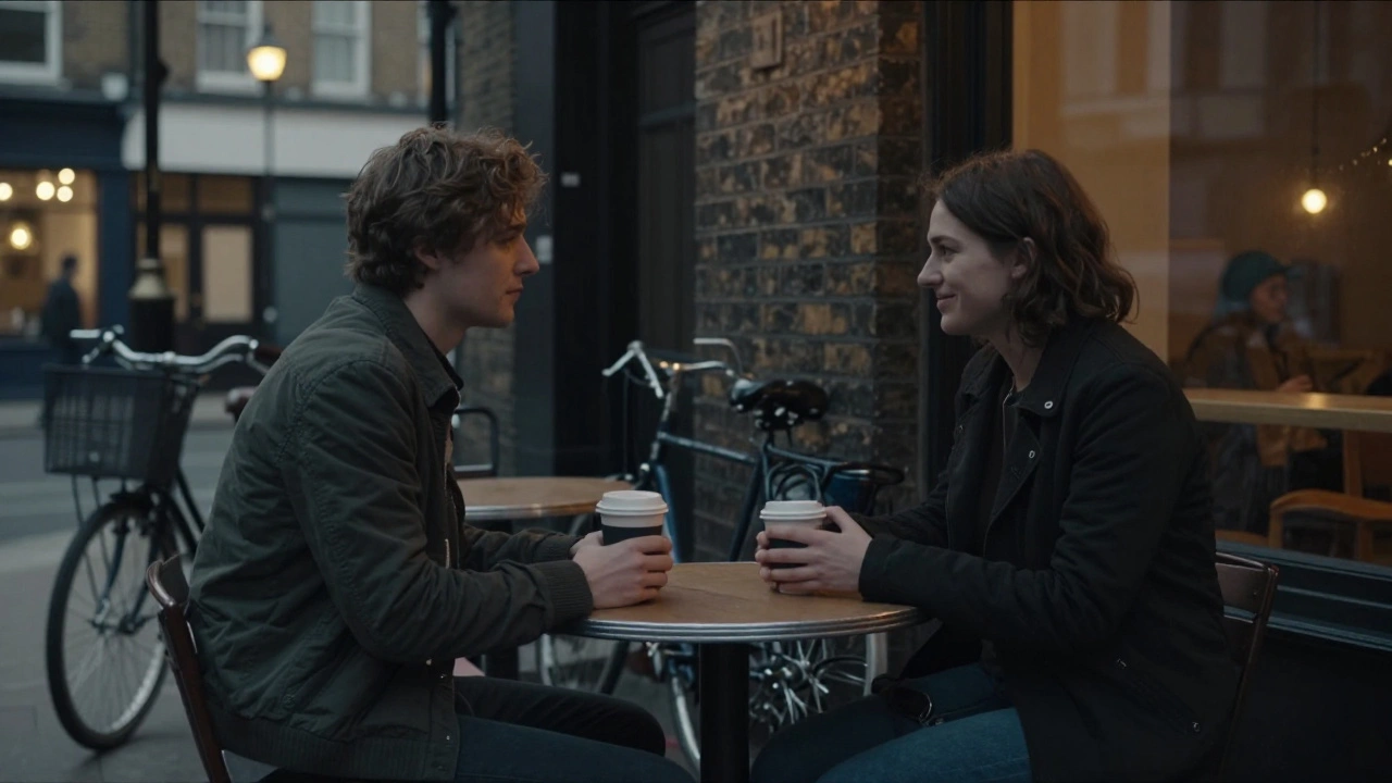 Two individuals share a quiet, respectful conversation at a café table in East London, exuding mutual comfort and trust.