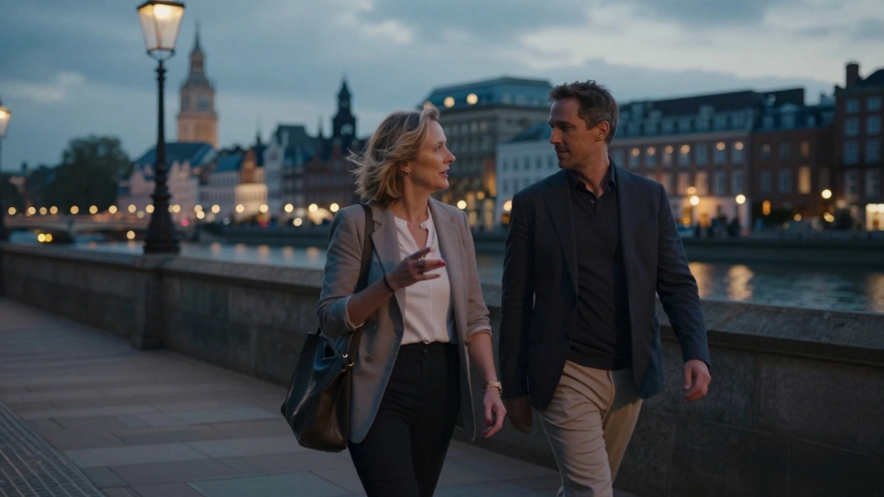 A woman and client walking peacefully along the Thames at dusk.