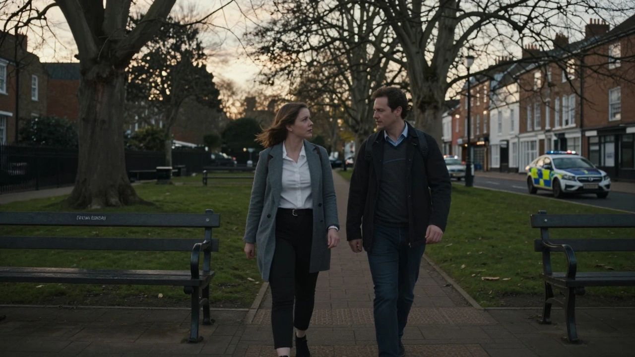 A couple walking peacefully in a London park at sunset, surrounded by quiet urban scenery.