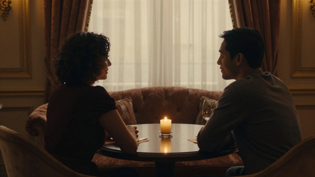 Two figures seated privately at a table in a warm upscale lounge.